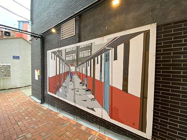 Murales explicativos de la vida en la ciudadela de Celestino Solar en Gijón