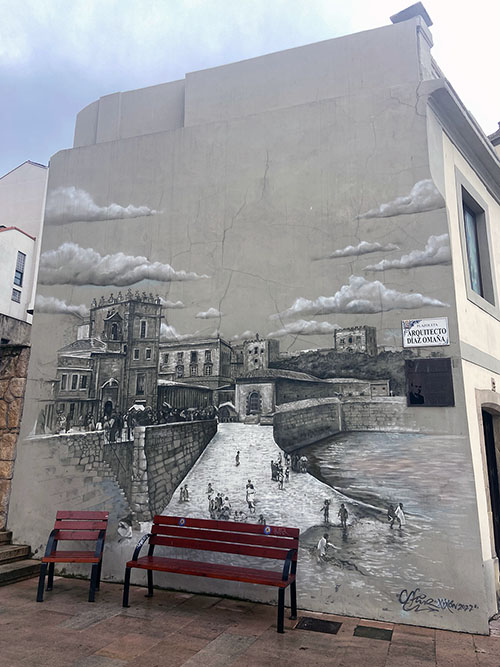Mural pintado en la pared de un edificio en Gijón